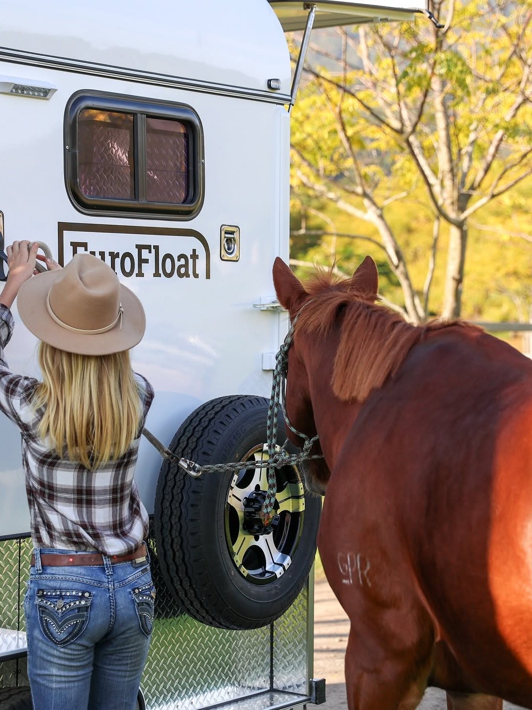 Rider and her horse beside a EuroFloat horse float