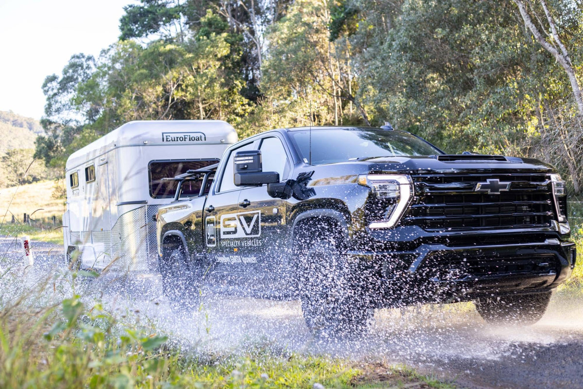 Llewellyn GMSV Silverado HD towing a EuroFloat through water